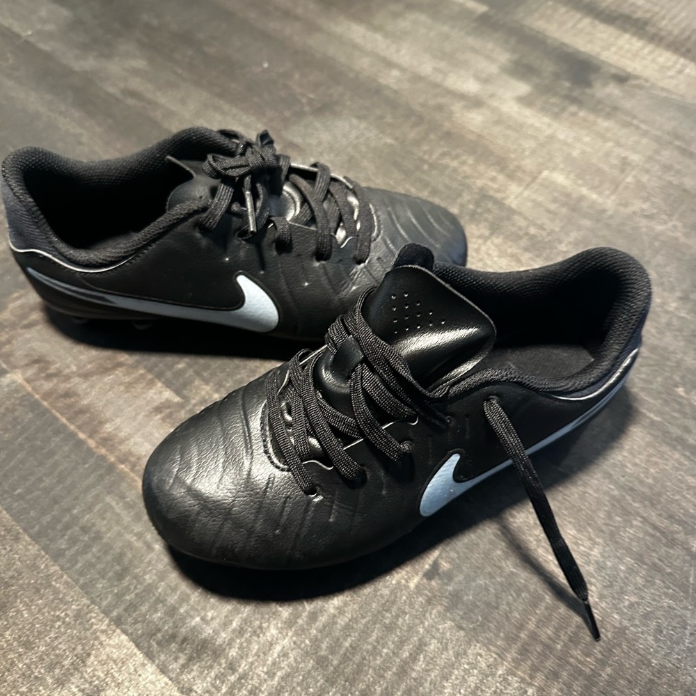 Nike Kids Black Soccer Cleats with light blue Swoosh